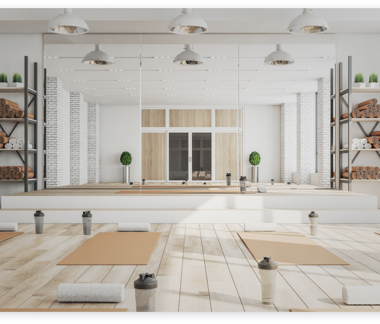 ヨガスタジオ(壁一面の大きな鏡、床にはヨガマット、タオル、ドリンクが置かれている)